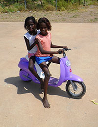 You couldn't say these girls weren't at school. They drove their scooter into the school carpark!